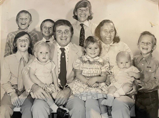 Centre: Dad and Mum (Michele and Jane) 
Back right: Michael 
Front left: Frank 
Left on Dad's knee: Phillip 
Middle front: Carmel (the only girl) 
Right bottom: Gino 
Right on Mum's knee: Me (baby) 
Back middle: Wally 
Back left of middle: Peter